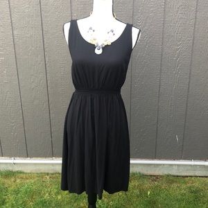 Black blouson style little black dress
